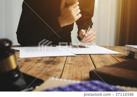 Young lawyer working hard job alone at his office 37118386