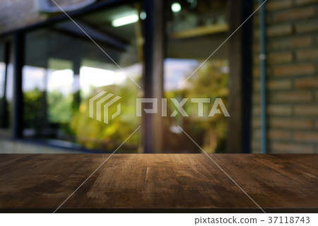 Empty wooden table in front of abstract blurred  37118743