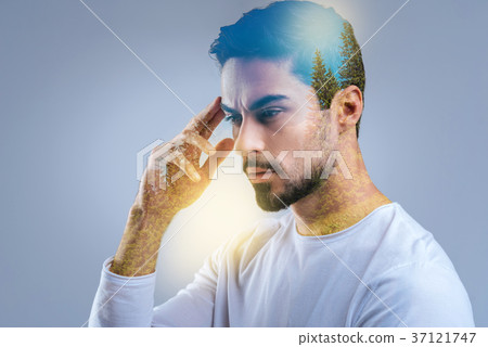 Creative thoughtful man imagining forest Creative thoughtful man imagining forest 37121747