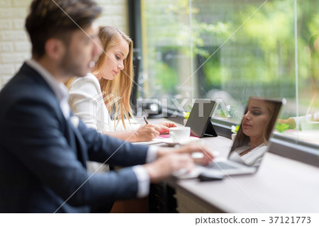 Business People using tablet in Coffee Shop. 37121773