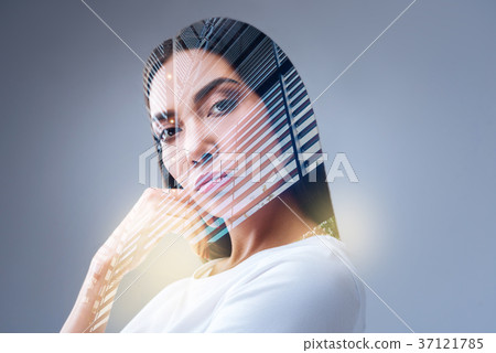 Attractive confident woman touching her cheek 37121785