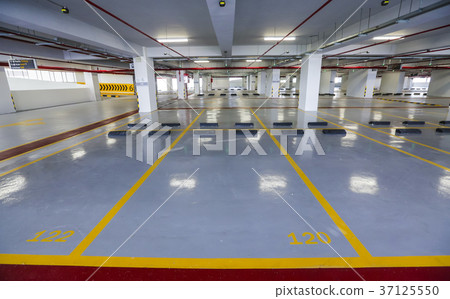 Empty indoor car parking space 37125550