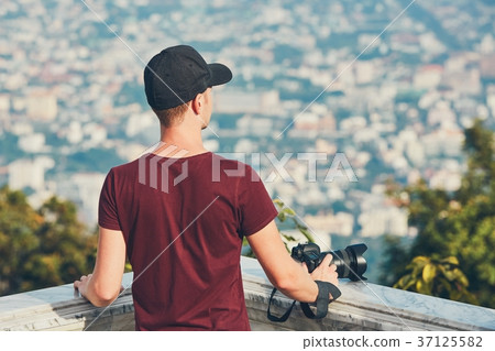 Young photographer with camera 37125582