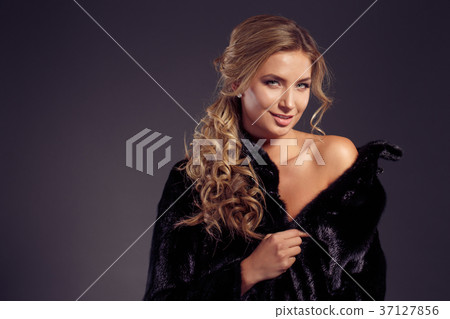 Fashion seductive blond hair lady in an elegant Fashion seductive blond hair lady in an elegant 37127856