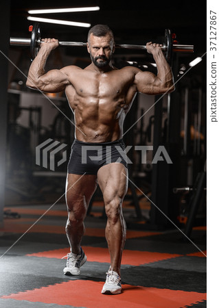 Old brutal strong bodybuilder athletic men pumping up muscles wi Old brutal strong bodybuilder athletic men pumping up muscles wi 37127867