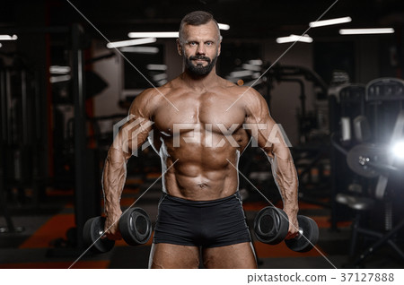 Old brutal strong bodybuilder athletic men pumping up muscles wi 37127888