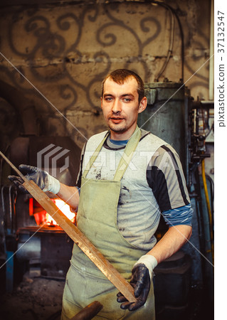 the blacksmith is at the forge 37132547