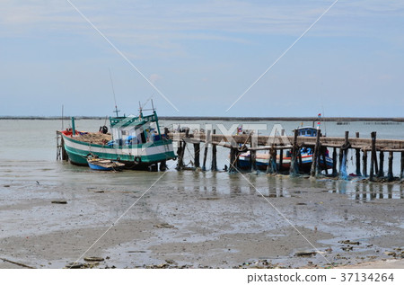 fishing boat on the seacoast. 37134264