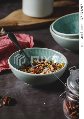 Muesli with dried berries and pecan nuts Muesli with dried berries and pecan nuts 37134267