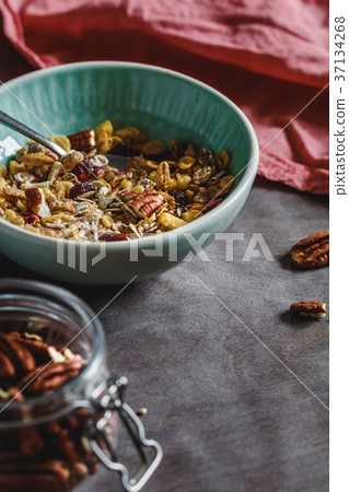 Muesli with dried berries and pecan nuts Muesli with dried berries and pecan nuts 37134268