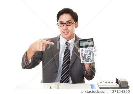 A smiling businessman with a computer A smiling businessman with a computer 37134890