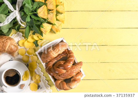 Coffee with pastry products and roses 37135937