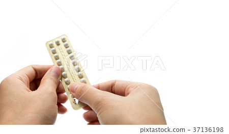 Woman hand taking birth control pills. Asian adult 37136198