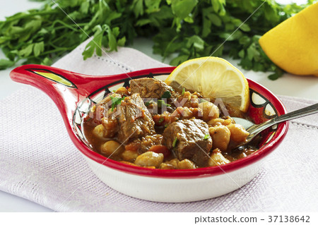 Moroccan soup harira with meat, chickpeas, lentils Moroccan soup harira with meat, chickpeas, lentils 37138642