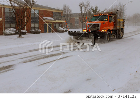 Machinery with snowplough cleaning removing snow Machinery with snowplough cleaning removing snow 37141122