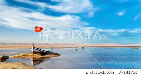 Boat on Chott el Djerid, a dry lake in Tunisia Boat on Chott el Djerid, a dry lake in Tunisia 37141716