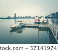 Blurred image of boats parked around a wooden dock 37141974