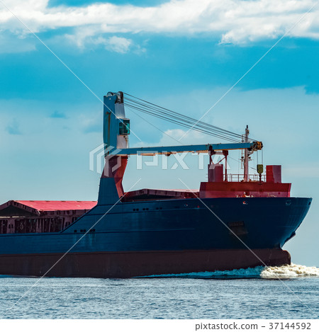 Blue cargo ship underway 37144592