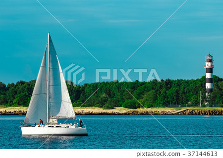 White sailboat traveling at Riga White sailboat traveling at Riga 37144613