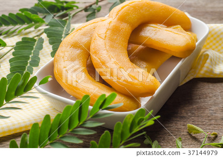 Pickled Tamarind Fruit on wooden background. 37144979