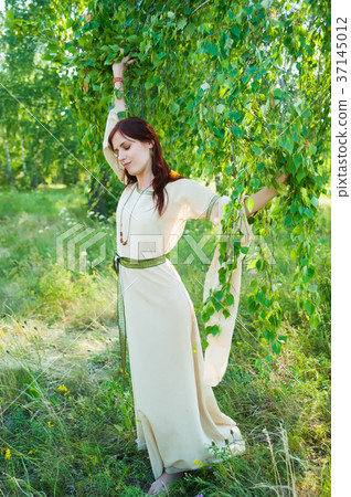 Portrait of young pretty woman with flower wreath 37145012