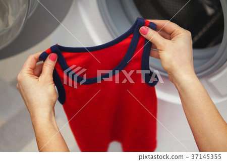 red T-shirt in the hands red T-shirt in the hands 37145355