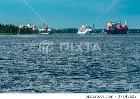 Blue cargo ship underway 37145622