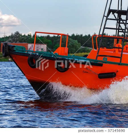 Orange pilot boat in action Orange pilot boat in action 37145690
