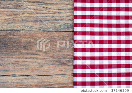 Tablecloth in white and red cage on wooden table Tablecloth in white and red cage on wooden table 37146309