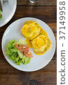 Eggs Benedict with salad top view 37149958