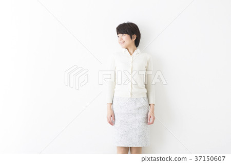 A woman standing with a smile A woman standing with a smile 37150607