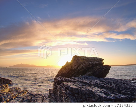 Stony beach and cliff of rocky bay. Blue tones 37154333