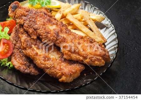 Fried fish in crispy batter with chips Fried fish in crispy batter with chips 37154454