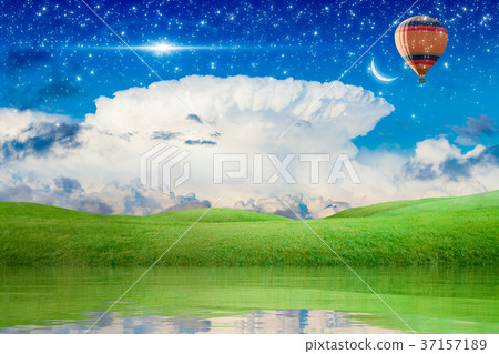 Hot air balloon flying in starry sky to new moon 37157189
