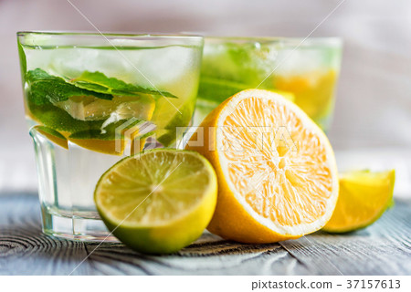 Lemonade or mojito cocktail with lemon and mint Lemonade or mojito cocktail with lemon and mint 37157613