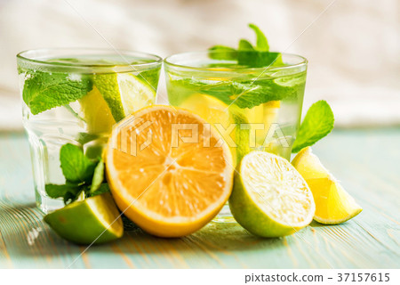 Lemonade or mojito cocktail with lemon and mint Lemonade or mojito cocktail with lemon and mint 37157615