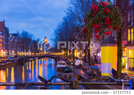Night illumination of Amsterdam canal and bridge Night illumination of Amsterdam canal and bridge 37157751