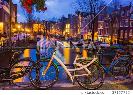 Night illumination of Amsterdam canal and bridge 37157753