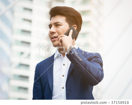 Business man speaking on the phone 37158918