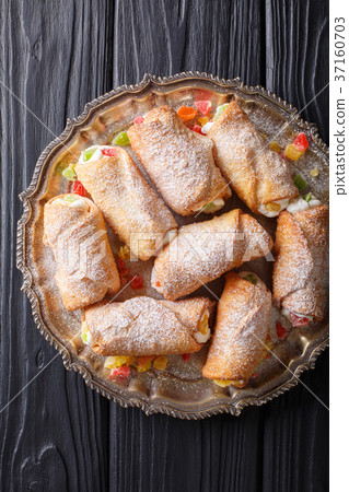 sweet cannoli stuffed with cheese cream sweet cannoli stuffed with cheese cream 37160703
