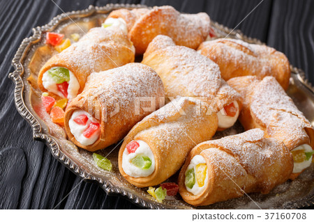 Sicilian cannoli stuffed with ricotta Sicilian cannoli stuffed with ricotta 37160708