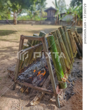 Glutinous Rice Grilled in Bamboo Joints Glutinous Rice Grilled in Bamboo Joints 37160729