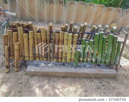 Glutinous Rice Grilled in Bamboo Joints Glutinous Rice Grilled in Bamboo Joints 37160730