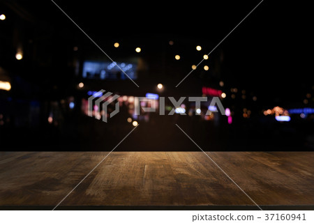Empty dark wooden table in front of abstract Empty dark wooden table in front of abstract 37160941