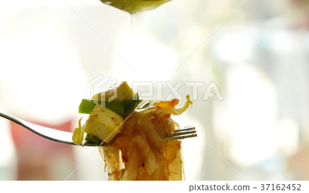 Pad Thai stir fried thin rice noodles on fork Pad Thai stir fried thin rice noodles on fork 37162452