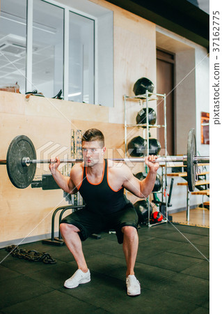 Hard gym workout body-building man concept. Hard gym workout body-building man concept. 37162775