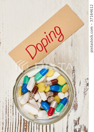 Glass jar of banned drugs 37164612