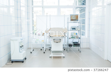 Gynecological surgery room with chair, equipment 37166247