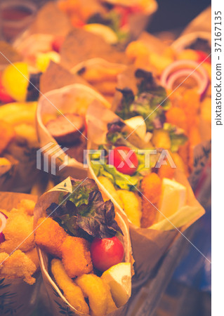 Fruits and vegetables stall in La Boqueria Fruits and vegetables stall in La Boqueria 37167135