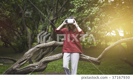 beautiful woman with virtual reality sitting on beautiful woman with virtual reality sitting on 37167930